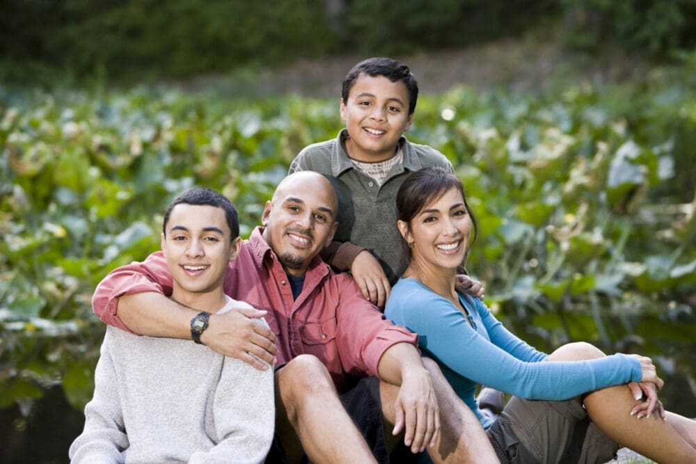 Family Bonding: Professional Counselor for Children Supporting Happy Hispanic Family